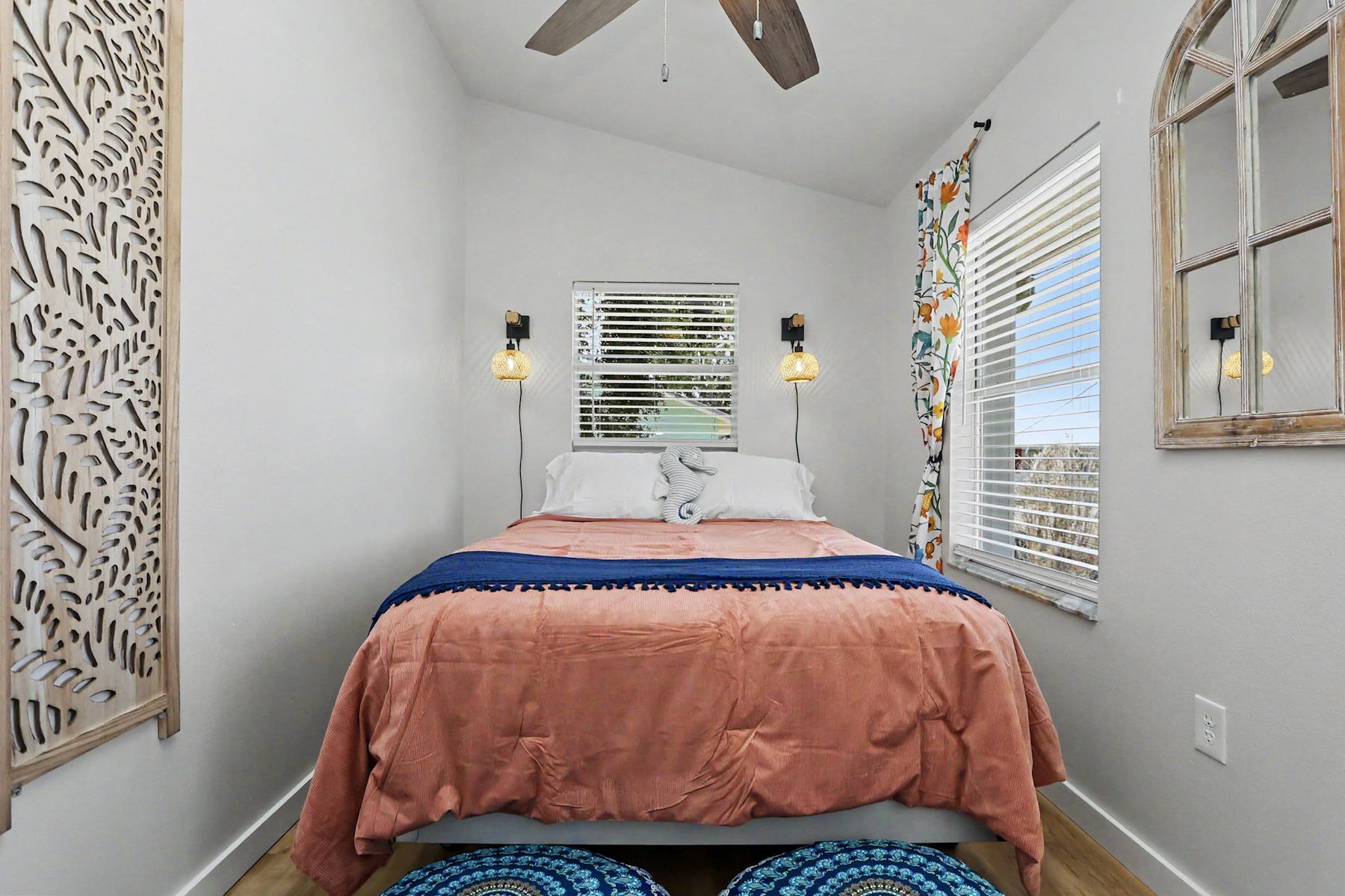 Coral bedspread and navy throw at The Rusty Hook Riverhouse, Old Homosassa, Florida