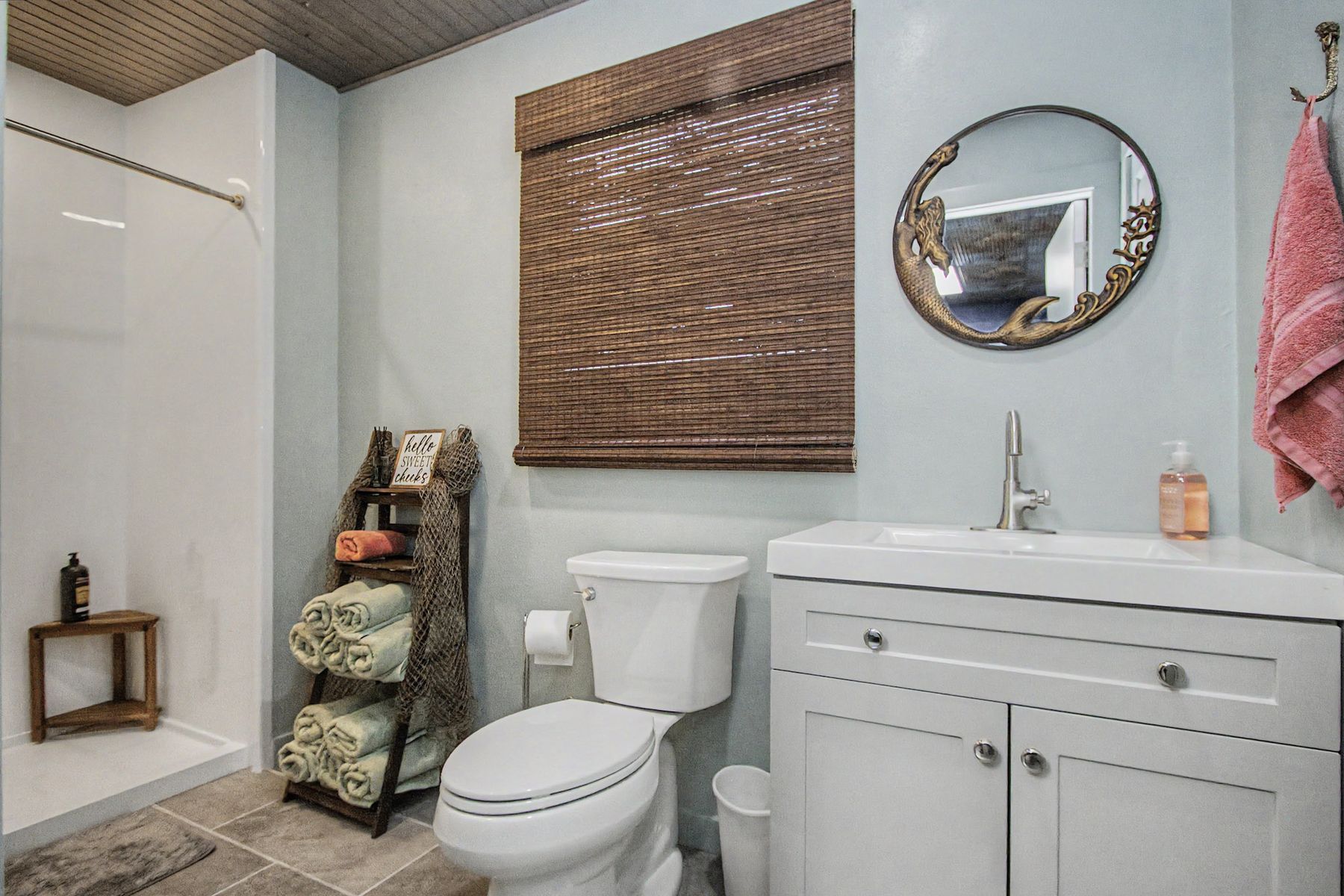 Vanity, mirror and the bamboo shade at The Rusty Hook Riverhouse, Old Homosassa, Florida
