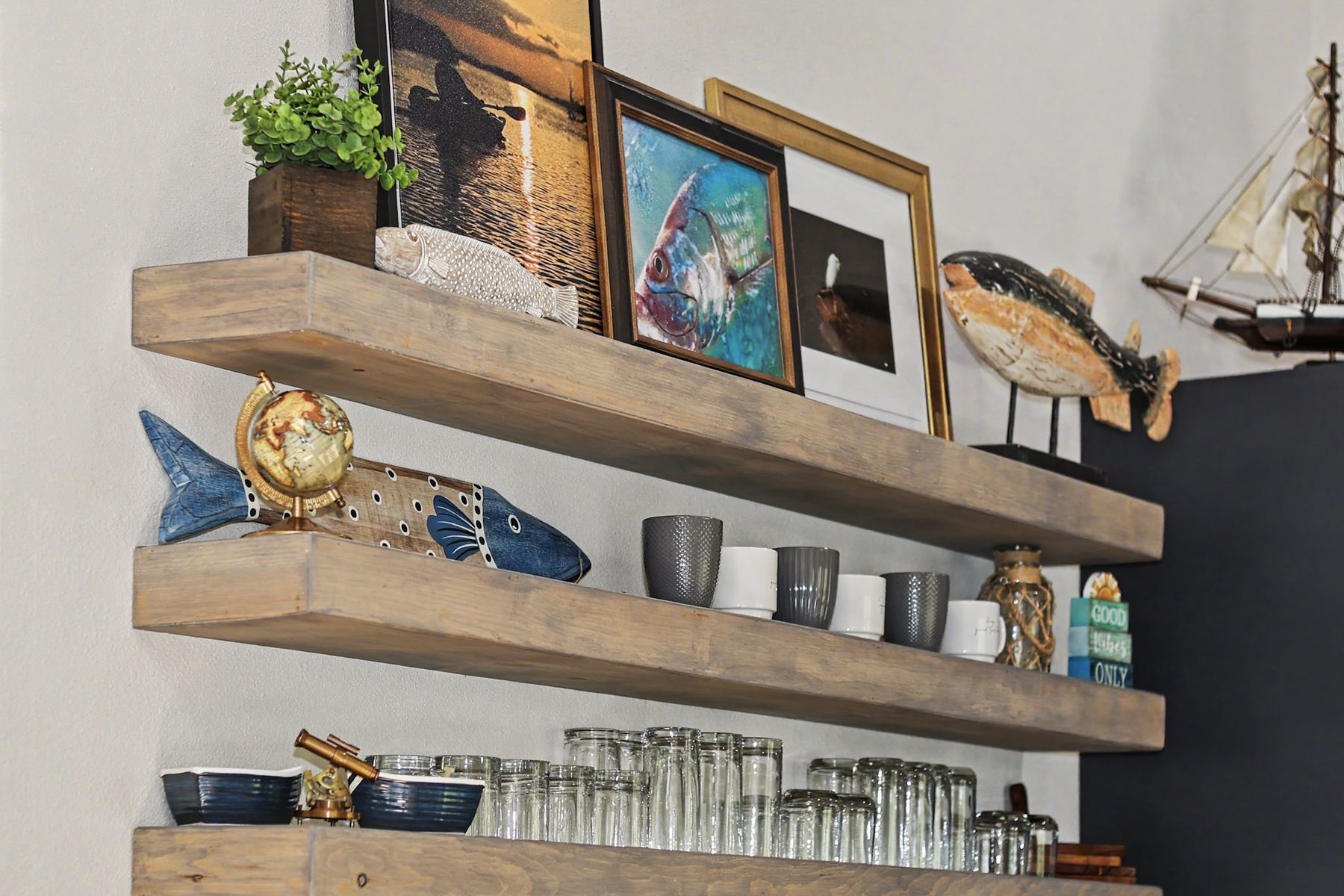 Open shelving and the fish carvings at The Rusty Hook Riverhouse, Old Homosassa, Florida