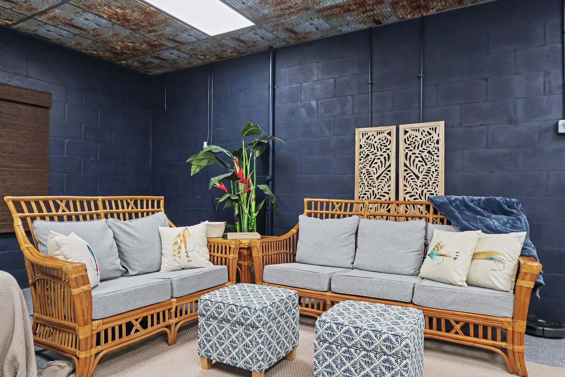 Rattan seating and the navy block wall at The Rusty Hook Riverhouse, Old Homosassa, Florida
