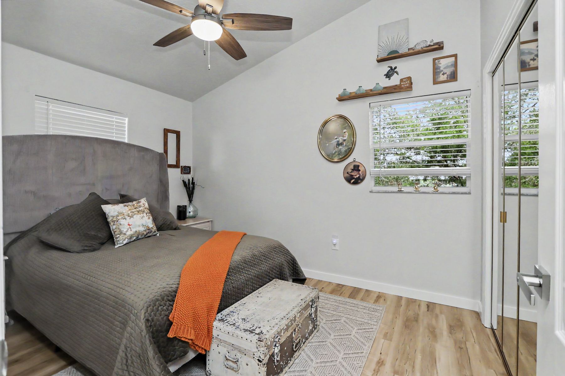 The grey-and-rust guest room at The Rusty Hook Riverhouse, Old Homosassa, Florida