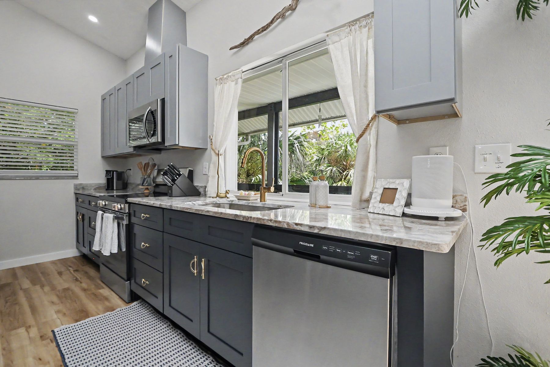 Range, dishwasher and stone counter at The Rusty Hook Riverhouse, Old Homosassa, Florida
