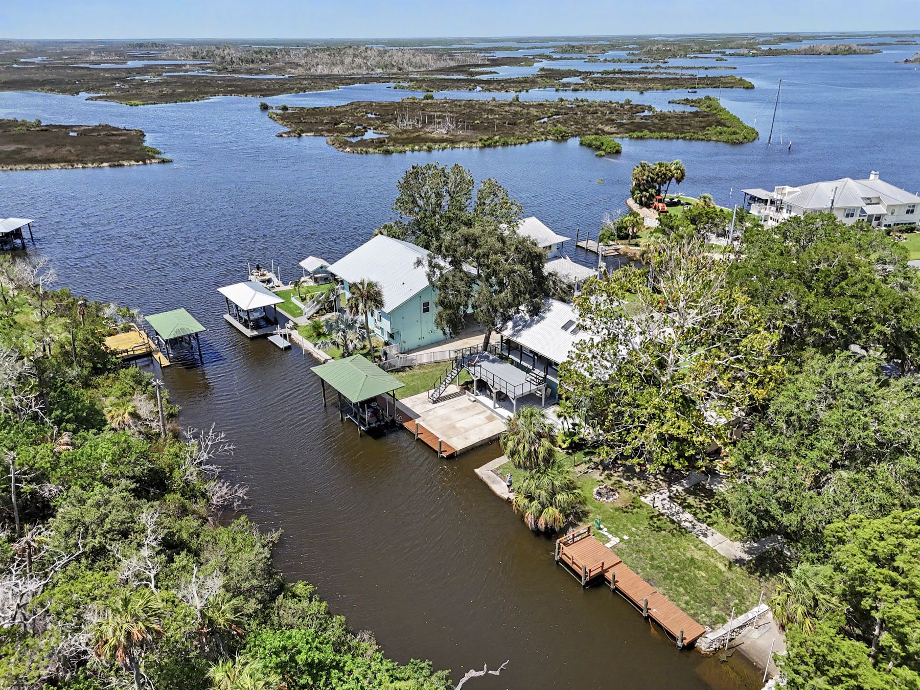The canal alongside the property at The Rusty Hook Riverhouse, Old Homosassa, Florida