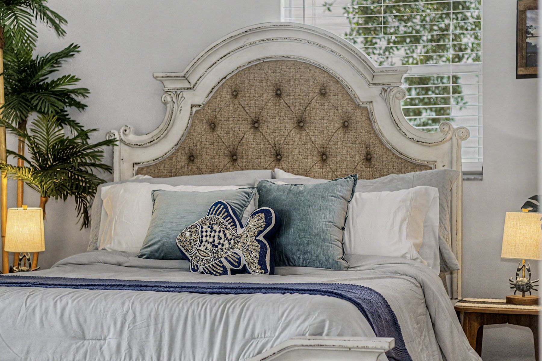 The carved headboard and the palms at The Rusty Hook Riverhouse, Old Homosassa, Florida