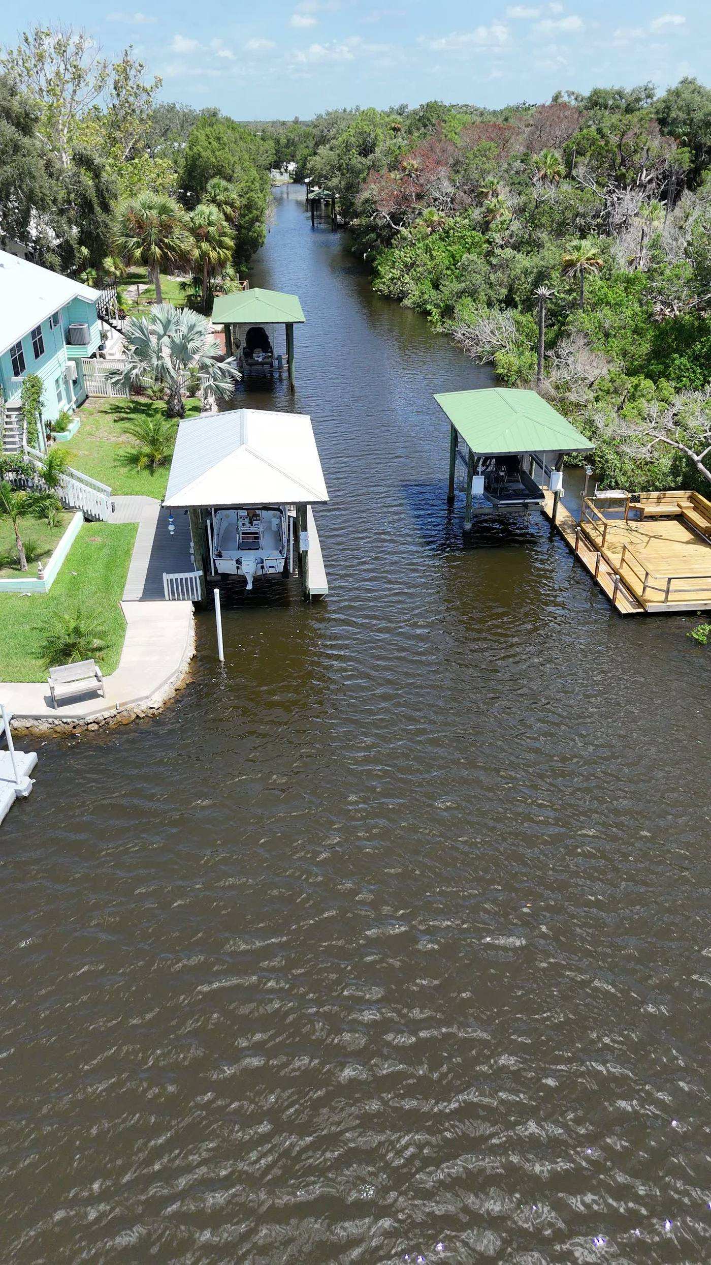 Mason Creek winding out toward the Gulf past docks and tidal grass