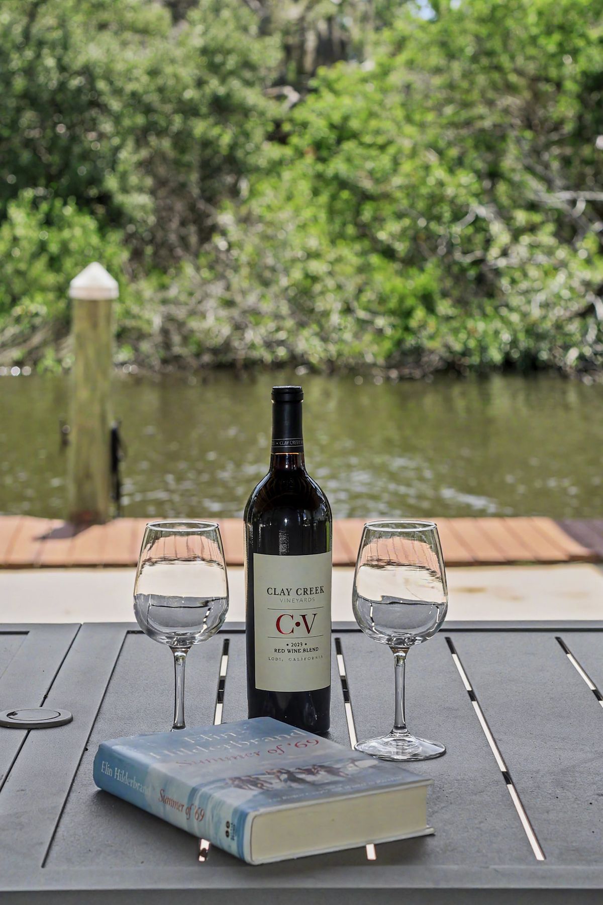 A bottle set down on the boards at The Rusty Hook Riverhouse, Old Homosassa, Florida