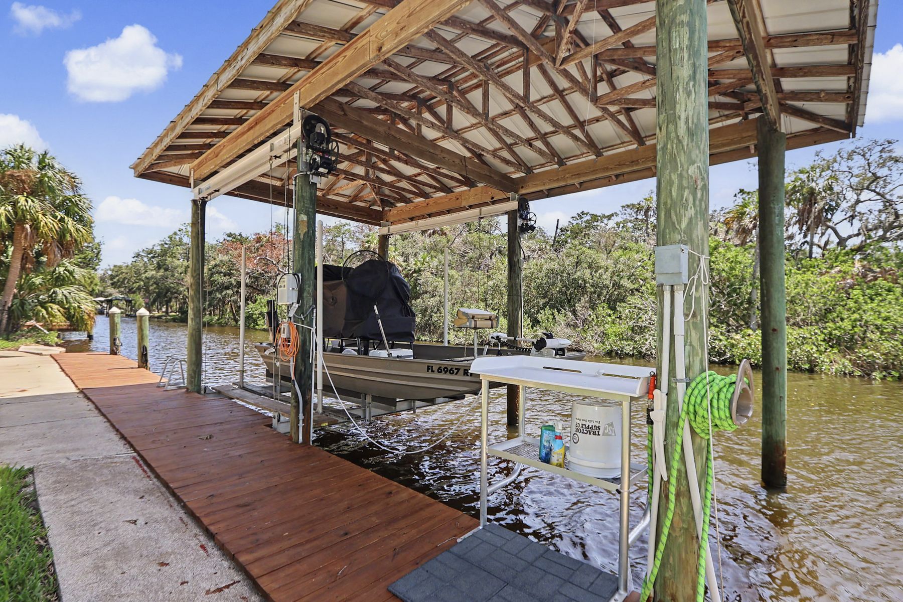 The grills and the cleaning station at the water at The Rusty Hook Riverhouse, Old Homosassa, Florida