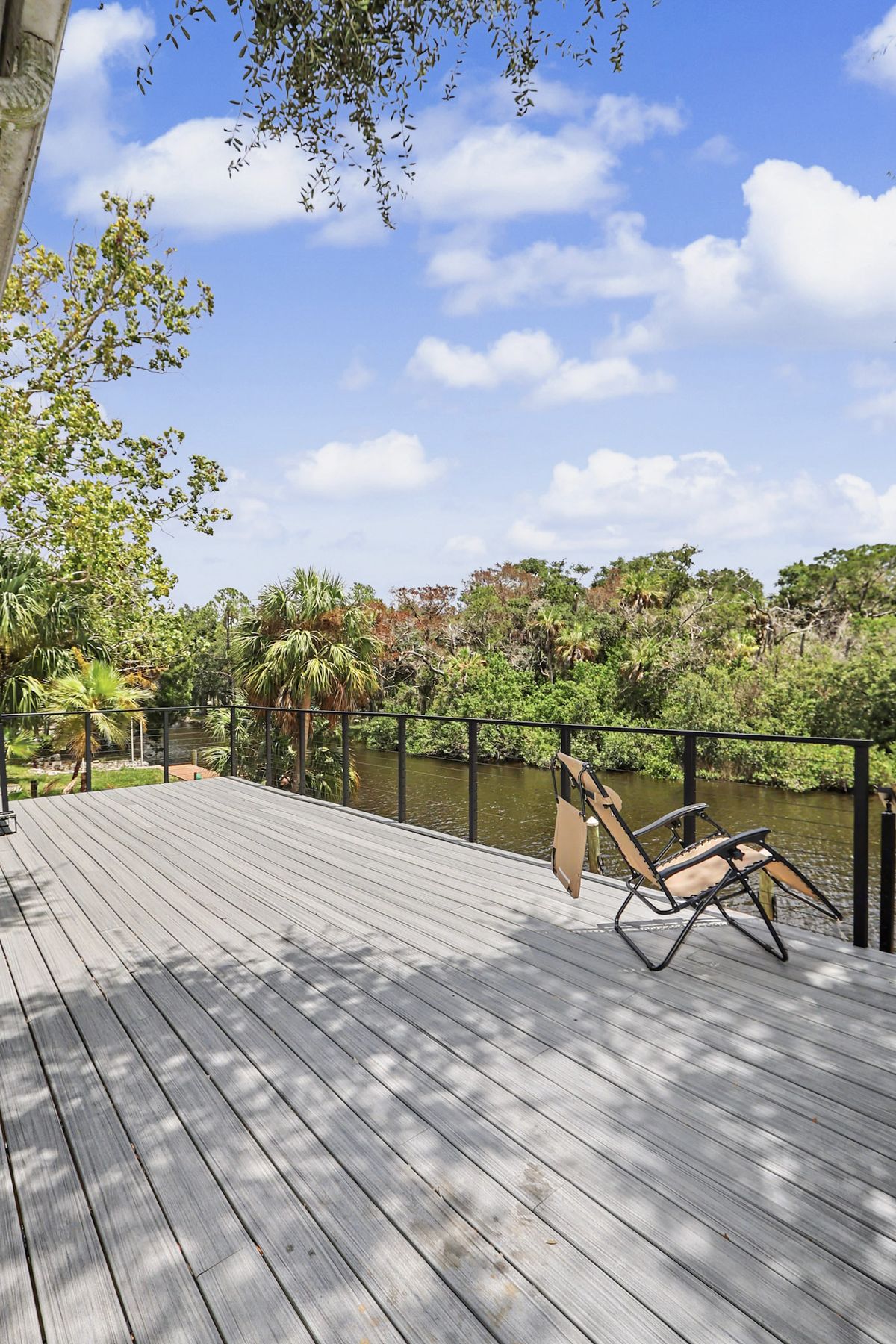 One chair, one long view at The Rusty Hook Riverhouse, Old Homosassa, Florida