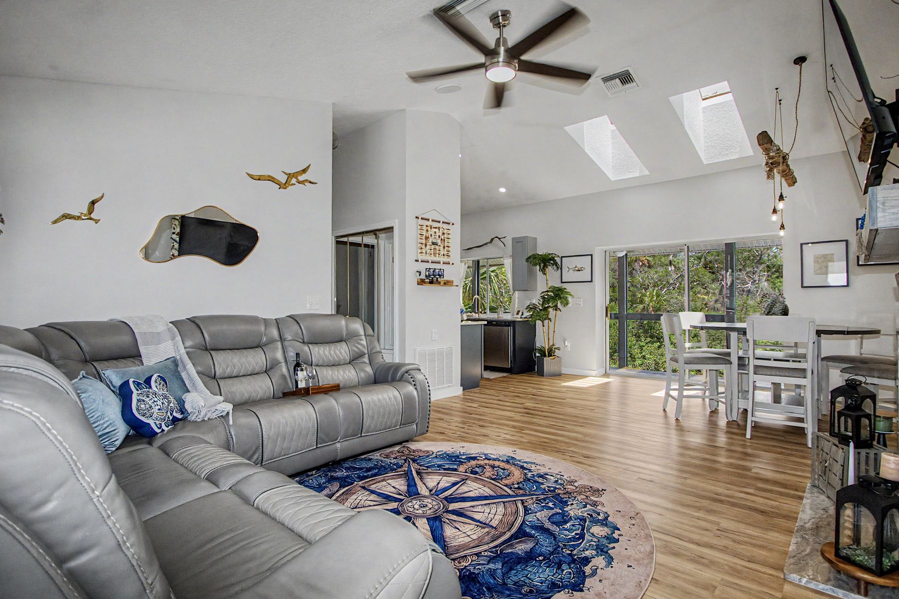 Sectional, skylights and the vaulted ceiling at The Rusty Hook Riverhouse, Old Homosassa, Florida