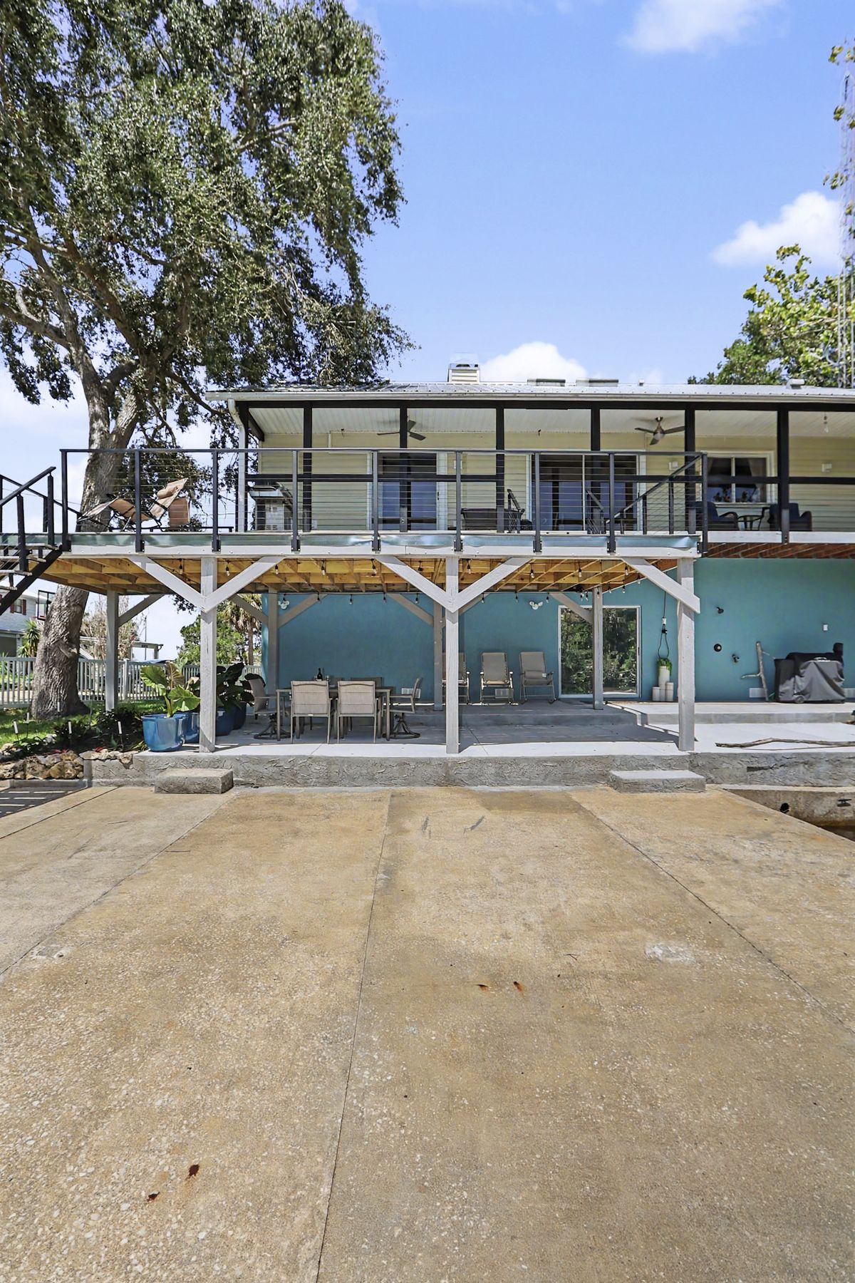Sliders, porch and the shaded parking beneath at The Rusty Hook Riverhouse, Old Homosassa, Florida