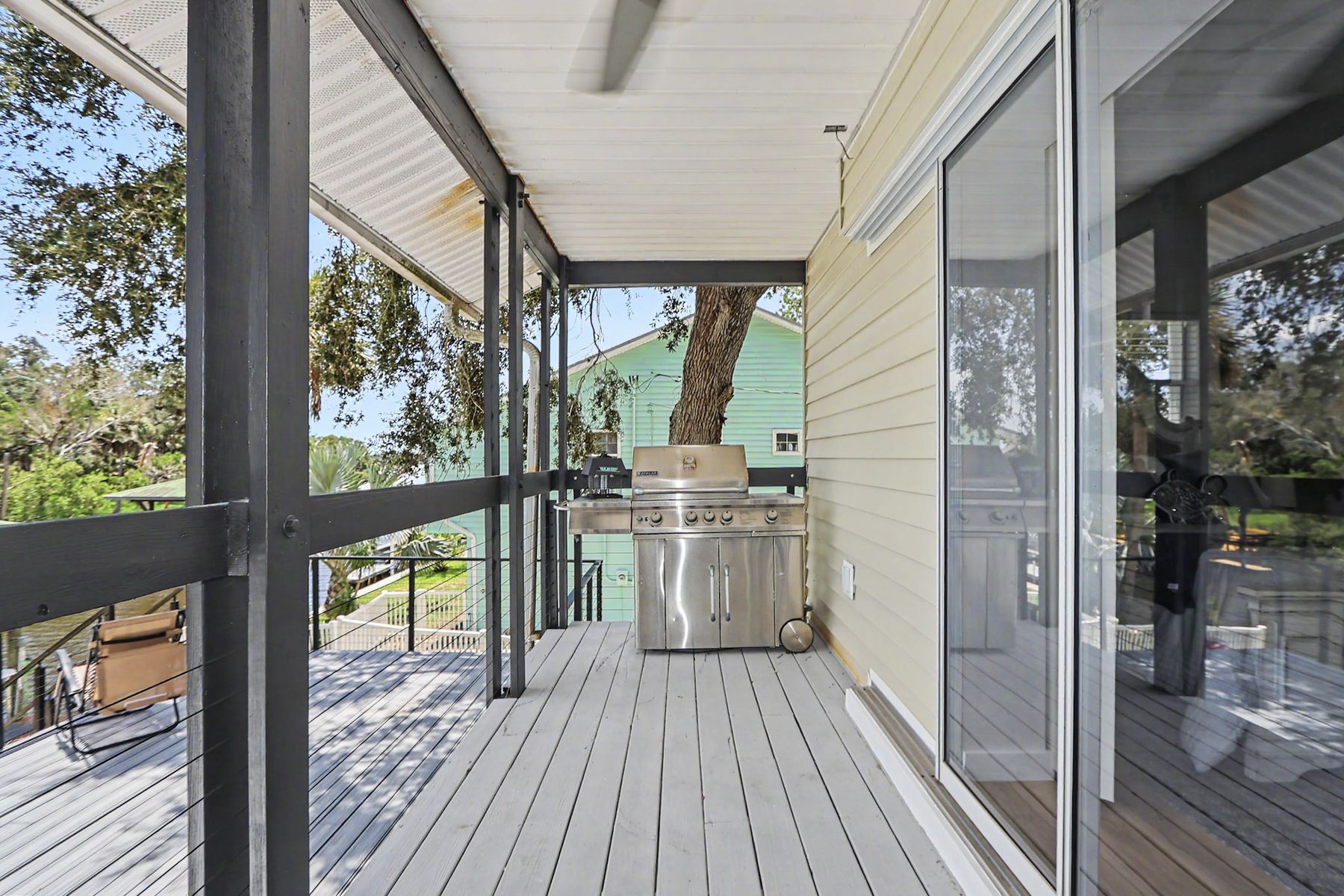Sliders open onto the porch at The Rusty Hook Riverhouse, Old Homosassa, Florida